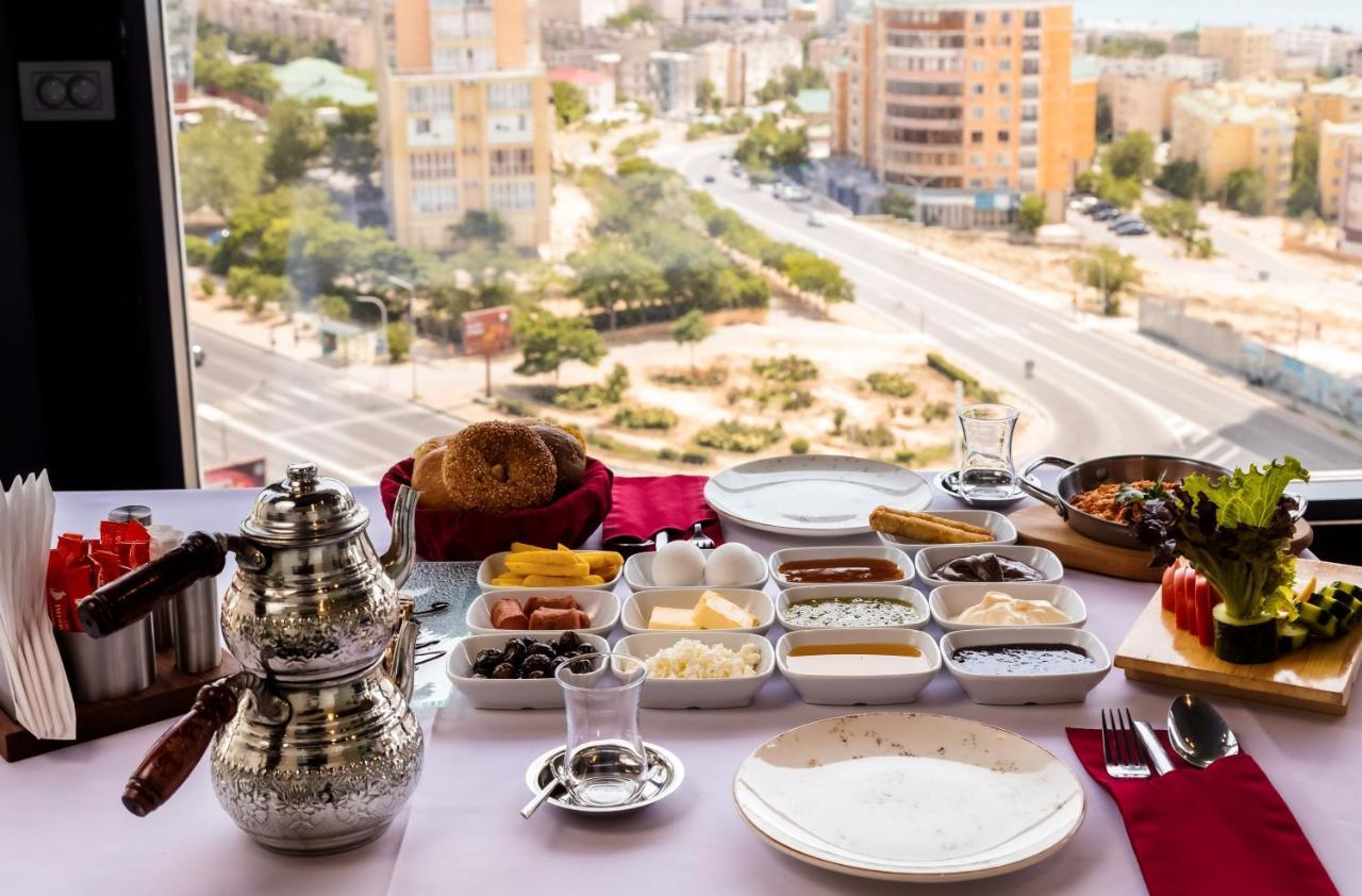 Grand Hotel Victory Aktau  Exterior photo Israeli breakfast