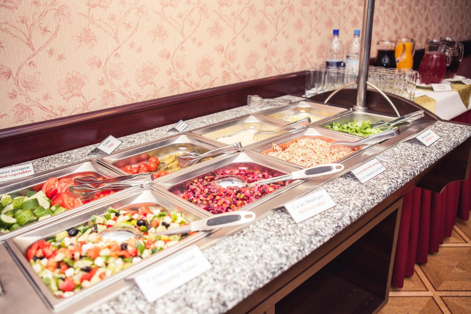 Grand Hotel Victory Aktau  Exterior photo A salad bar